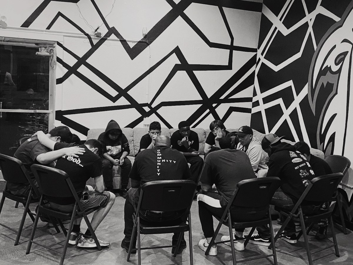 AGORA young men praying together