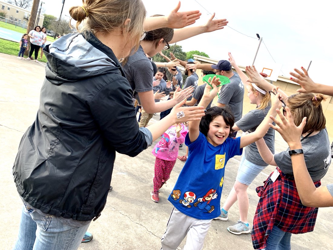 AGORA staff and kids at an outdoor sports activity