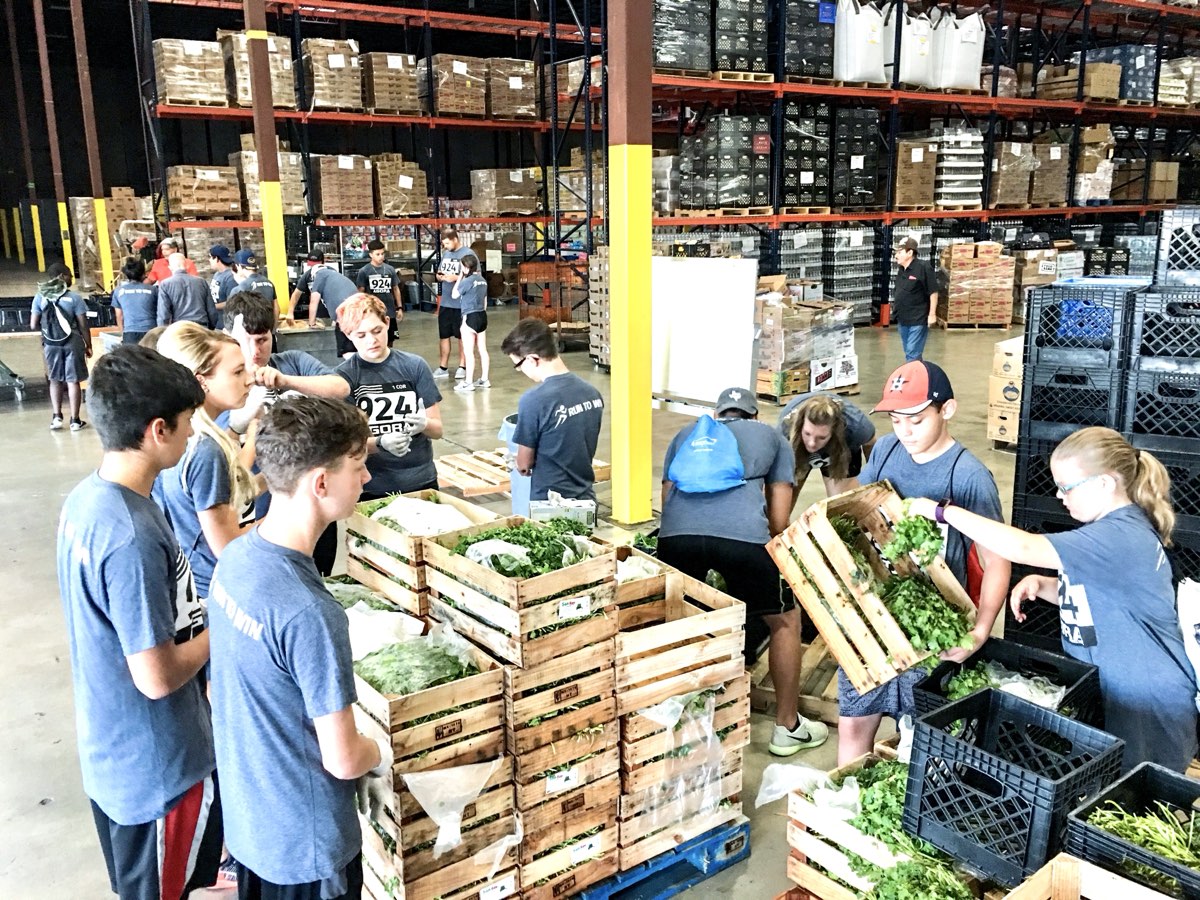AGORA students working in a food distribution warehouse